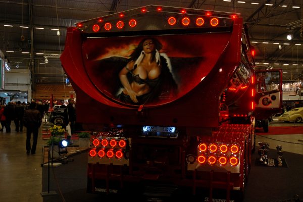 Rear view of a red custom show truck with airbrush artwork of an erotic Indian woman